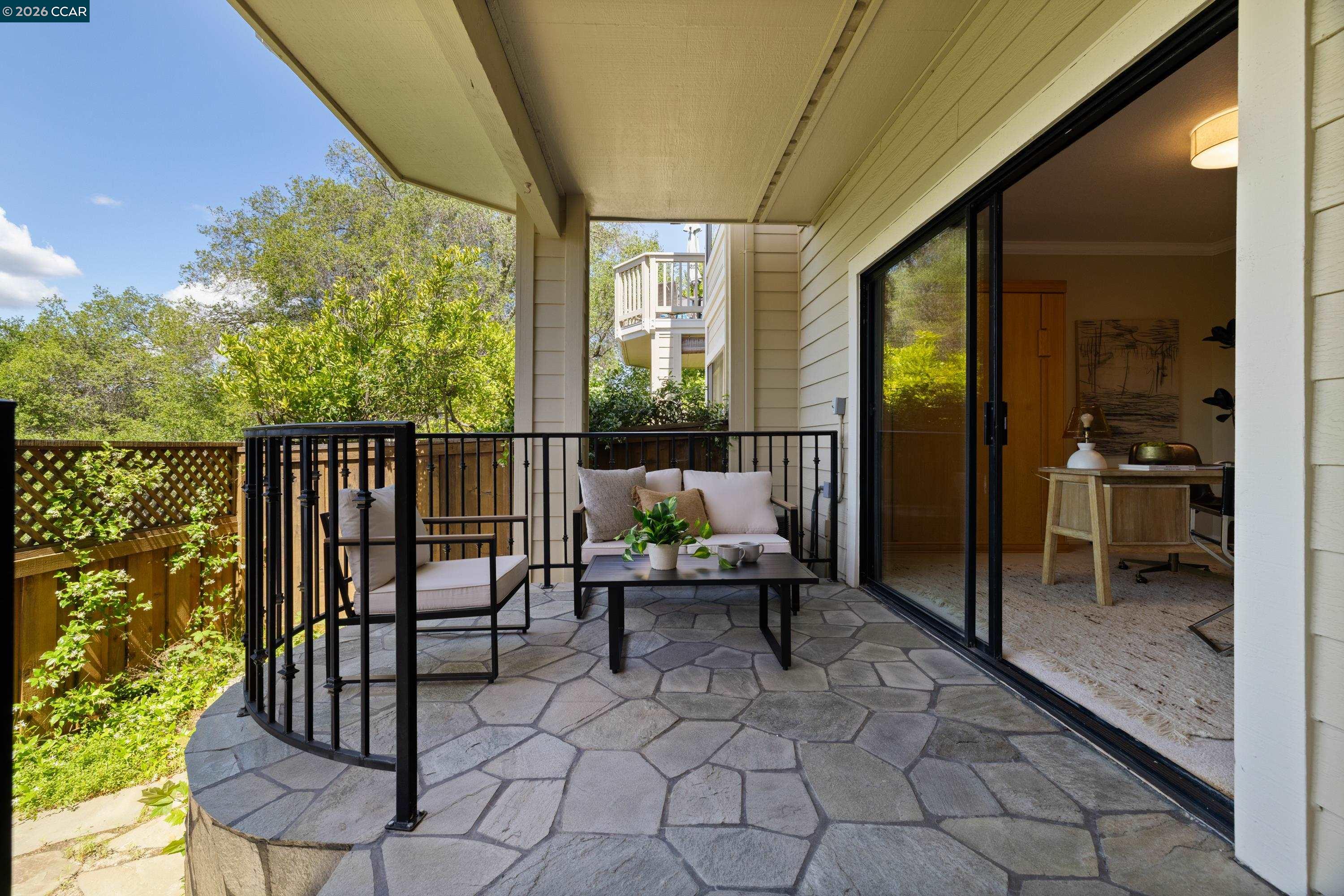 467 Beacon Ridge Lane Walnut Creek, CA 94597 - Photo 37 of 48 a balcony with chairs and table