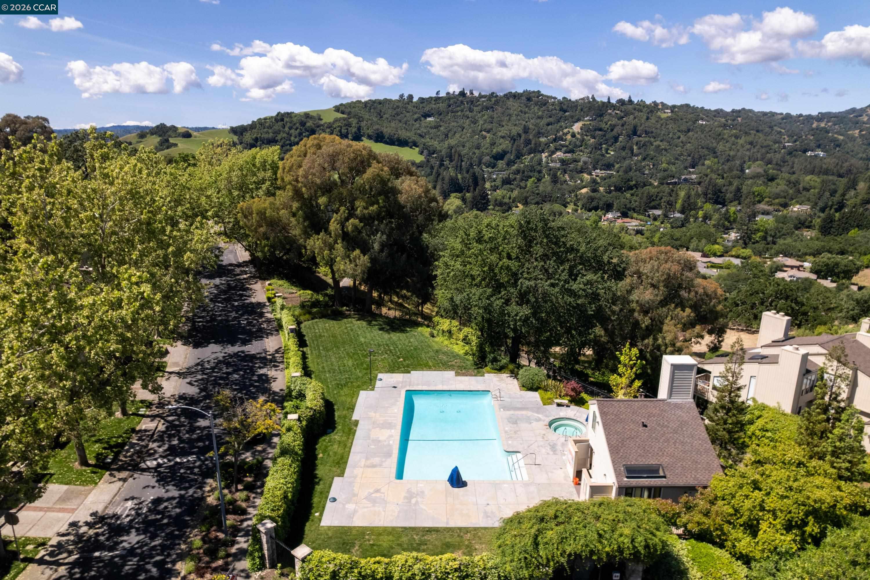 467 Beacon Ridge Lane Walnut Creek, CA 94597 - Photo 46 of 48 an aerial view of a house with a yard and lake view in back
