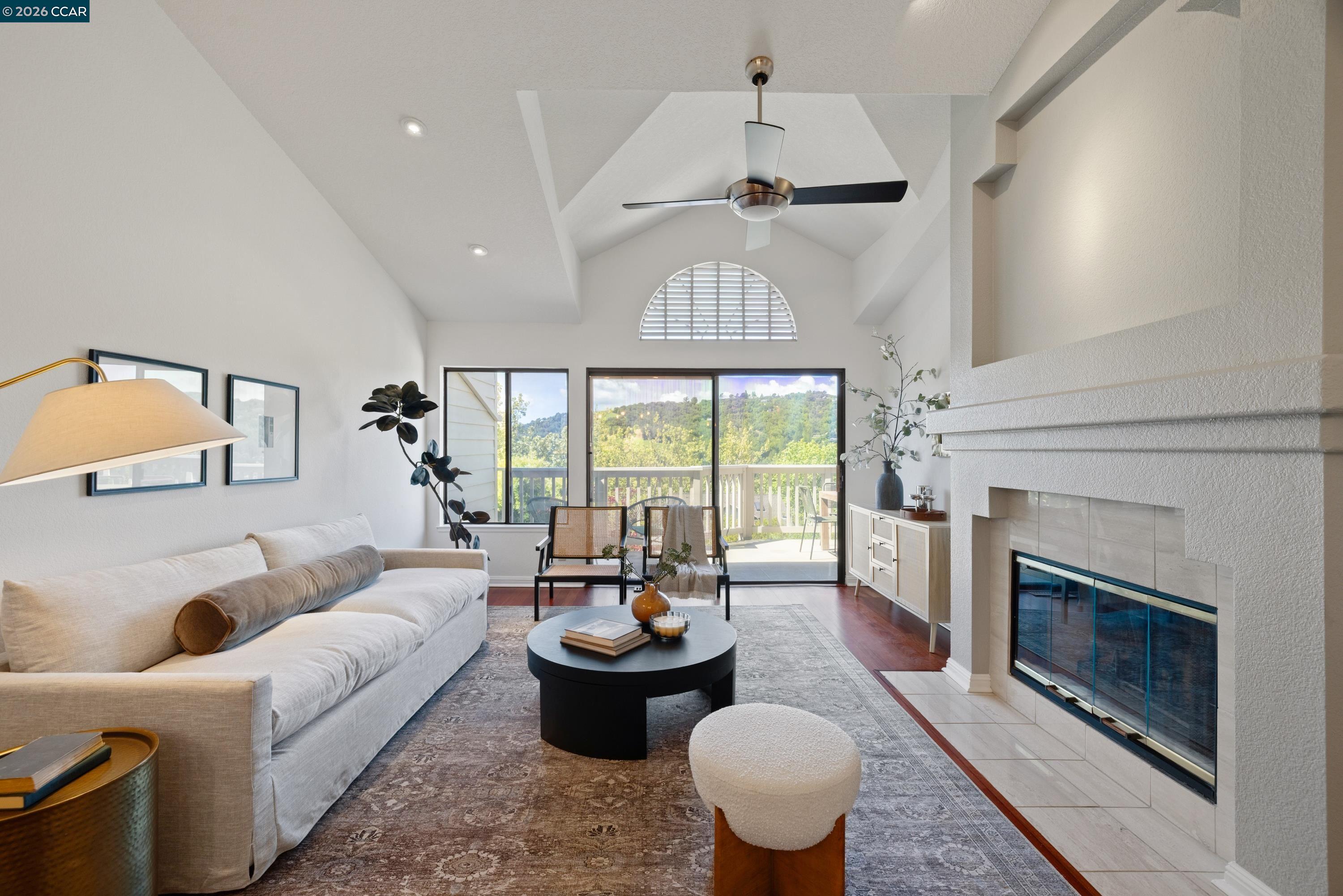 467 Beacon Ridge Lane Walnut Creek, CA 94597 - Photo 9 of 48 a living room with furniture a fireplace and a chandelier
