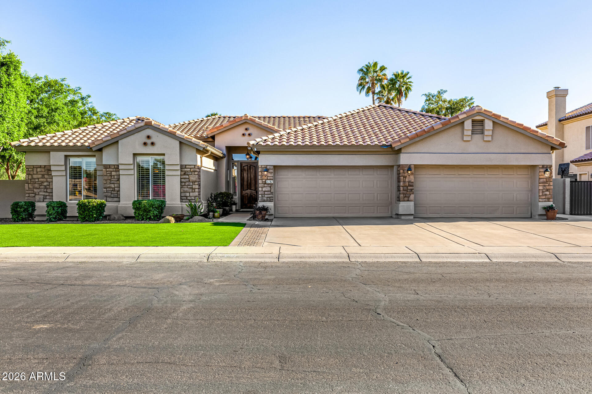 2187 East Finley Street Gilbert, AZ 85296 - Photo 12 of 89 a front view of a house with a yard and garage
