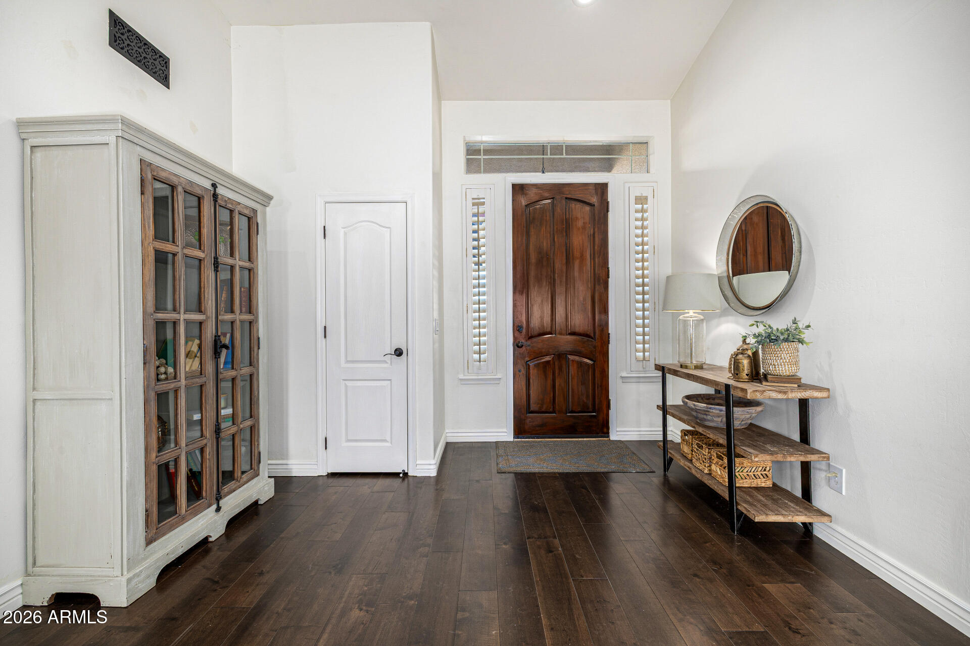 2187 East Finley Street Gilbert, AZ 85296 - Photo 14 of 89 a view of a hallway with wooden floor and entryway