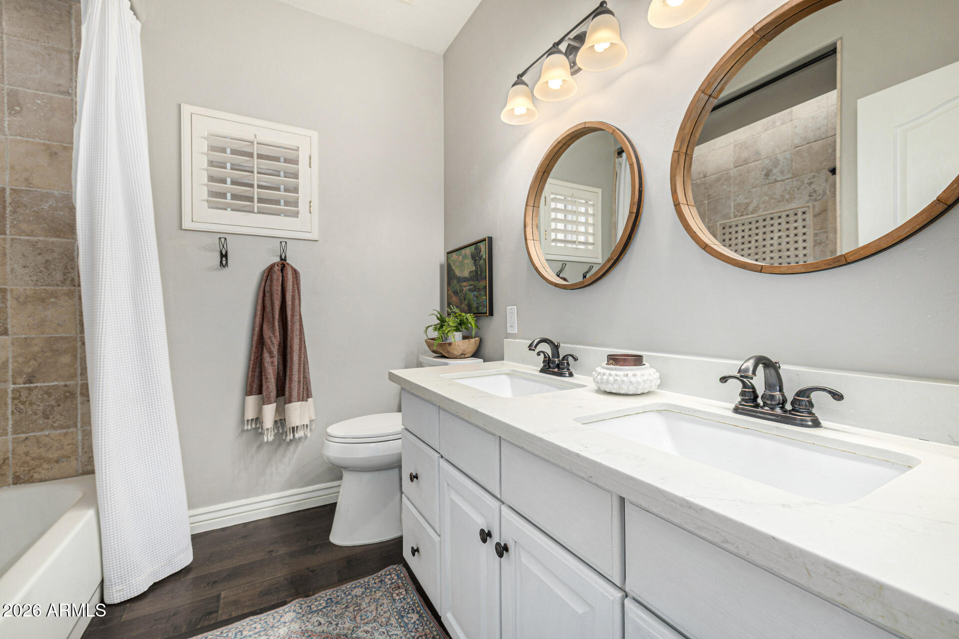 2187 East Finley Street Gilbert, AZ 85296 - Photo 48 of 89 a bathroom with a toilet a sink and a mirror