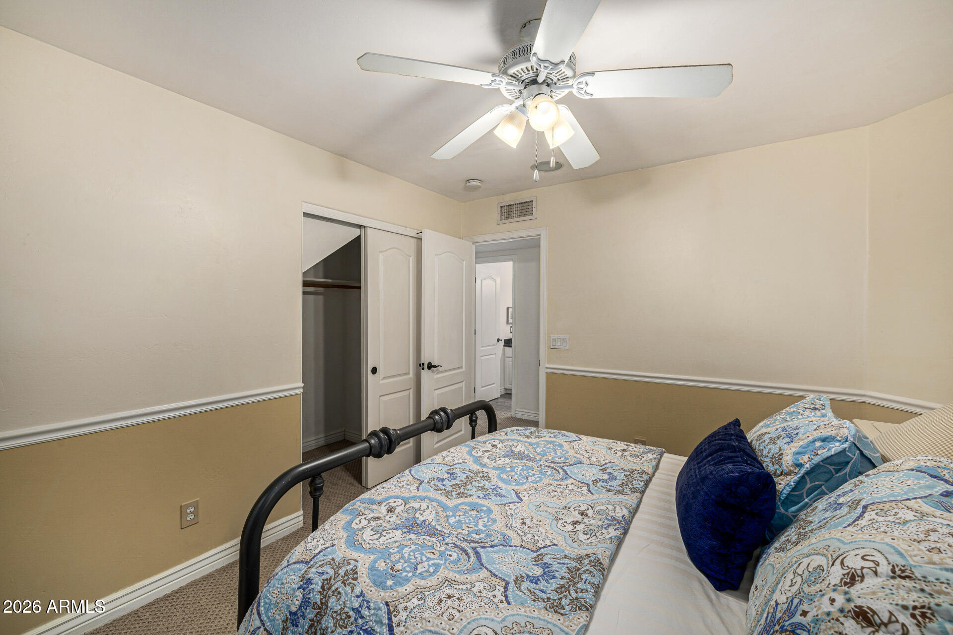 2187 East Finley Street Gilbert, AZ 85296 - Photo 53 of 89 a bedroom with a large bed and a chandelier
