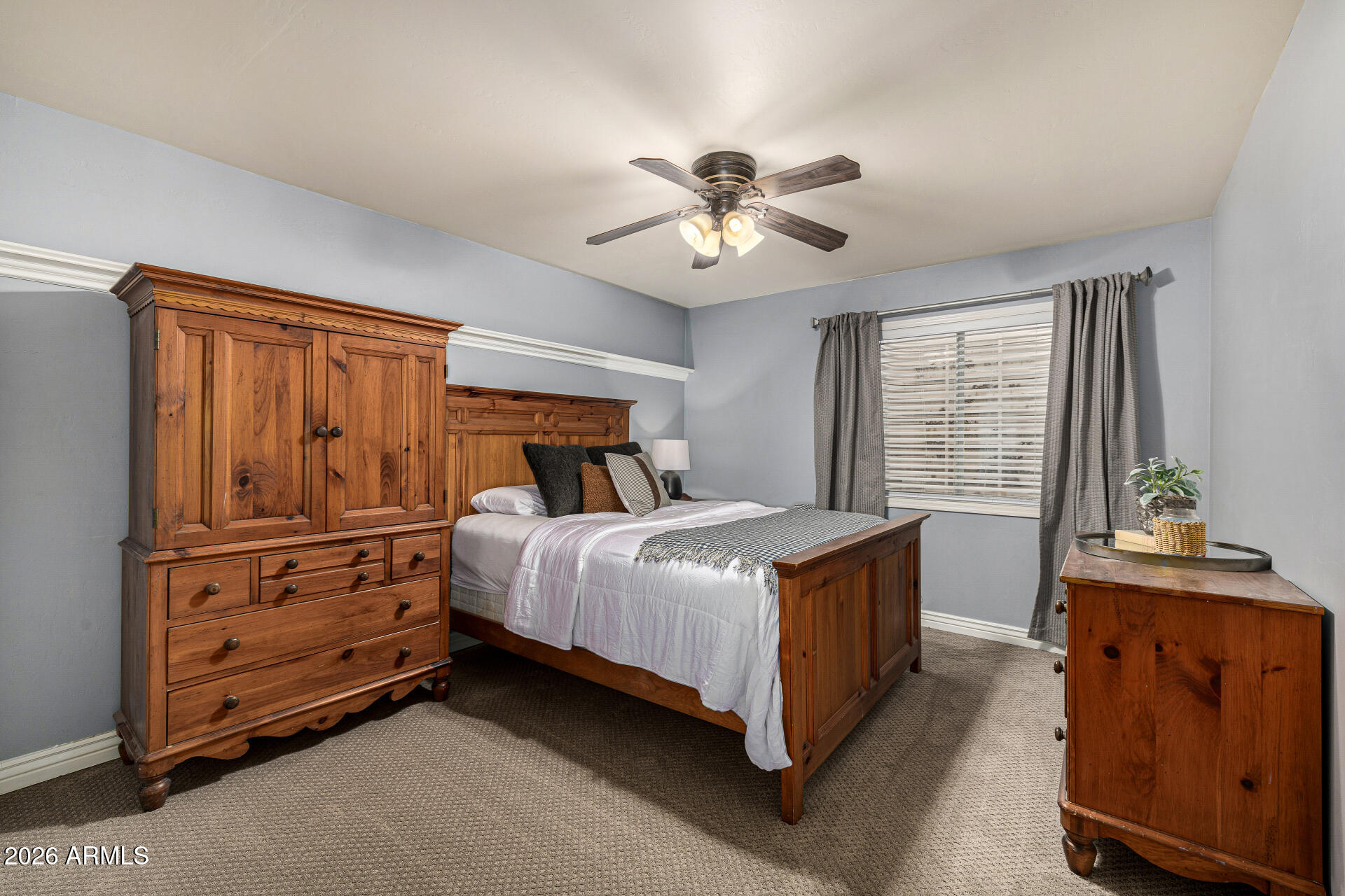 2187 East Finley Street Gilbert, AZ 85296 - Photo 54 of 89 a bedroom with a bed and a dresser