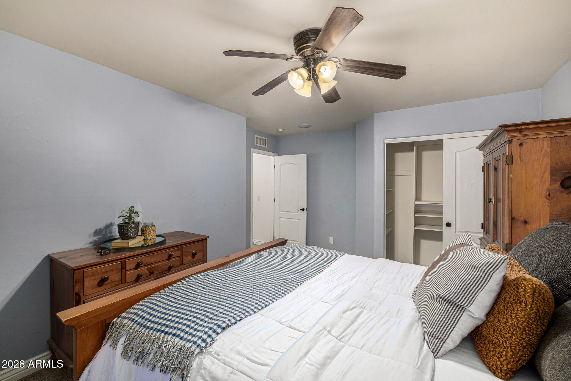 2187 East Finley Street Gilbert, AZ 85296 - Photo 55 of 89 a bedroom with a bed and a chandelier