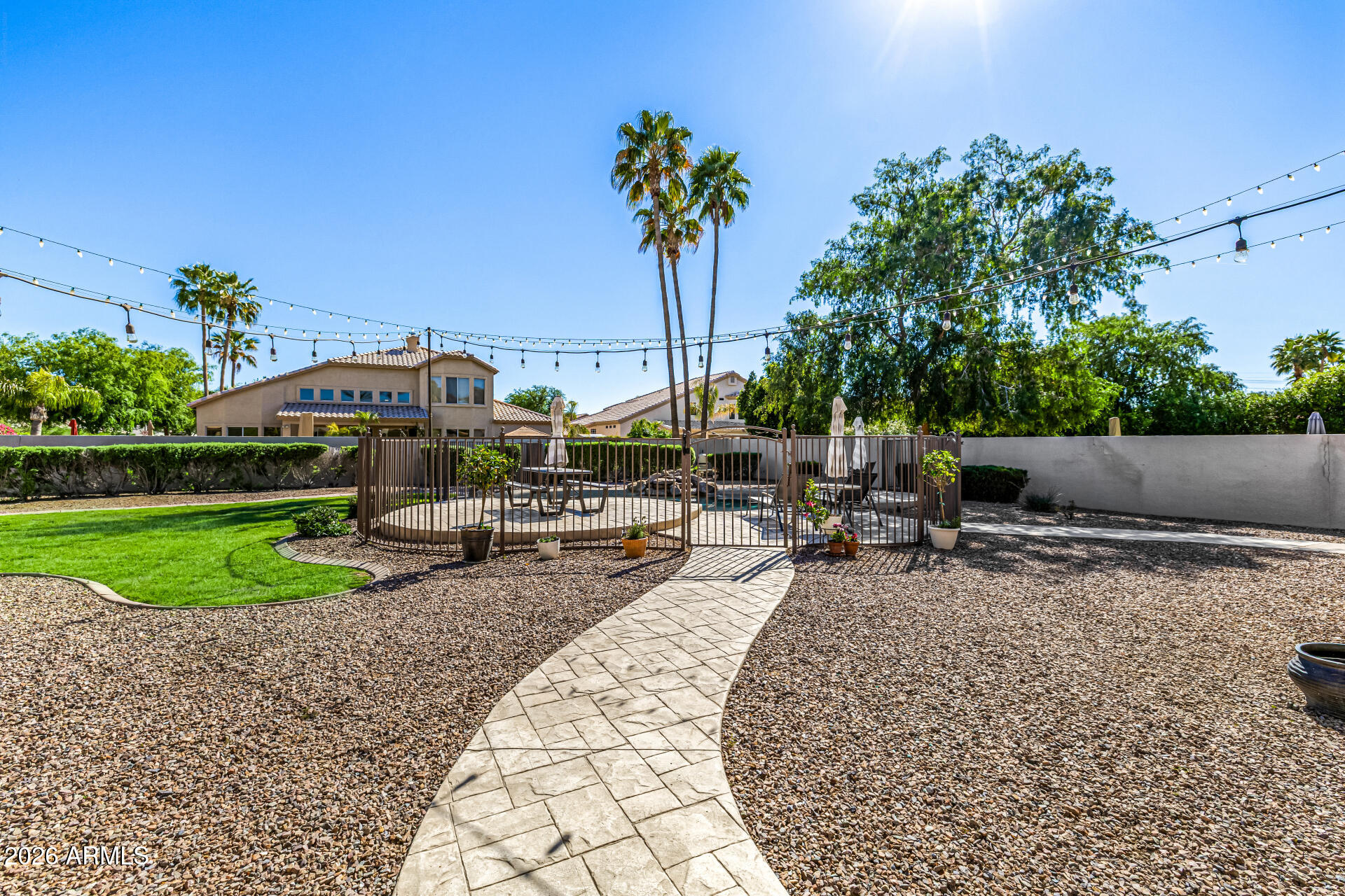 2187 East Finley Street Gilbert, AZ 85296 - Photo 69 of 89 a view of a backyard with swimming pool and sitting area