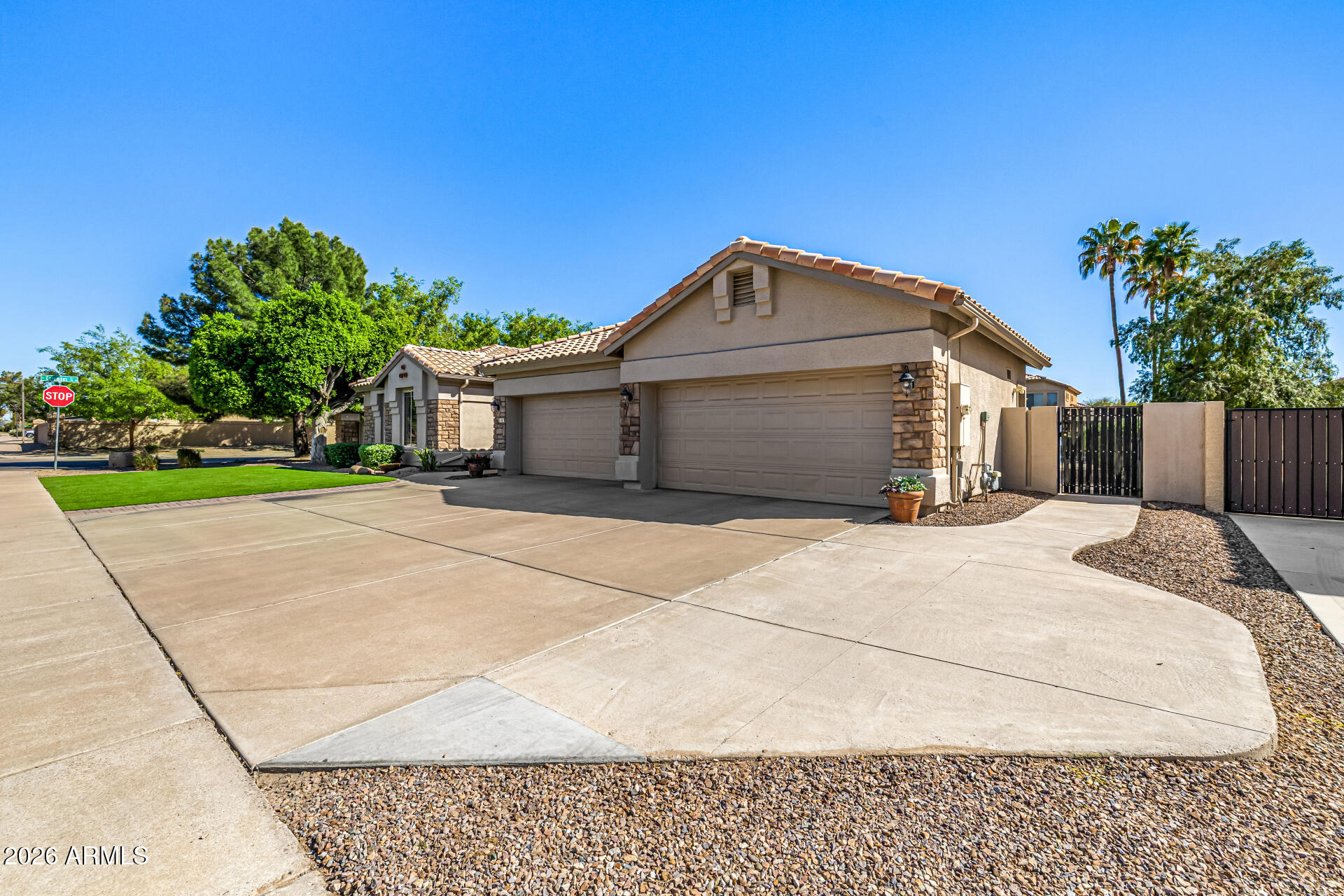2187 East Finley Street Gilbert, AZ 85296 - Photo 10 of 89 a front view of a house with a garden