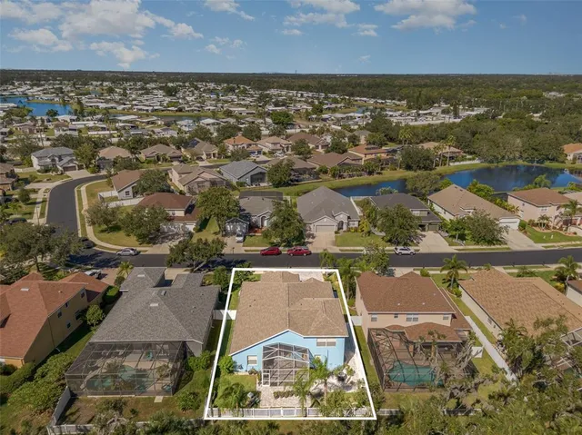 an aerial view of residential houses with outdoor space