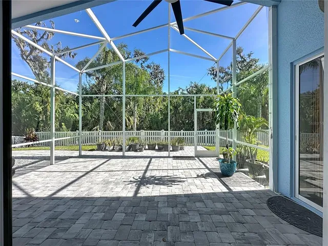 a view of a house with backyard and porch