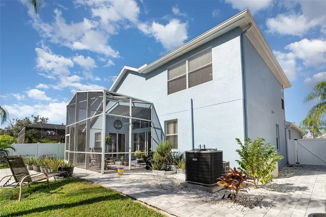 a view of a patio with table and chairs and potted plants