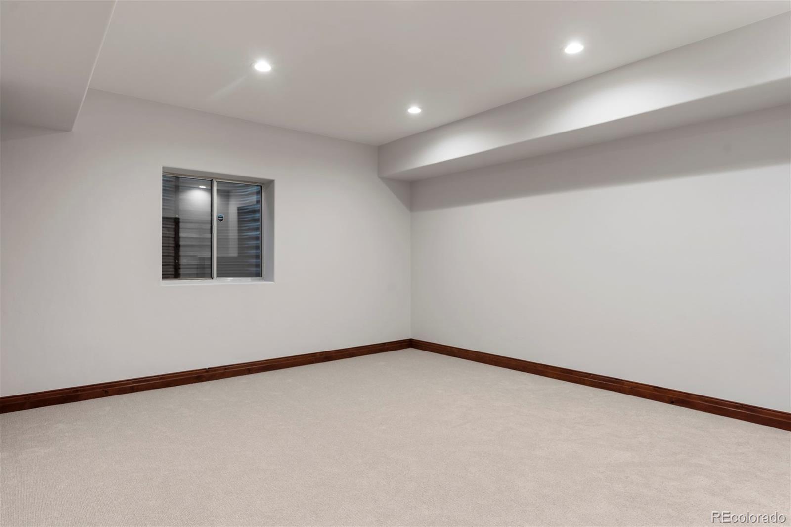 1026 South Cook Street Denver, CO 80209 - Photo 30 of 34 an empty room with a window