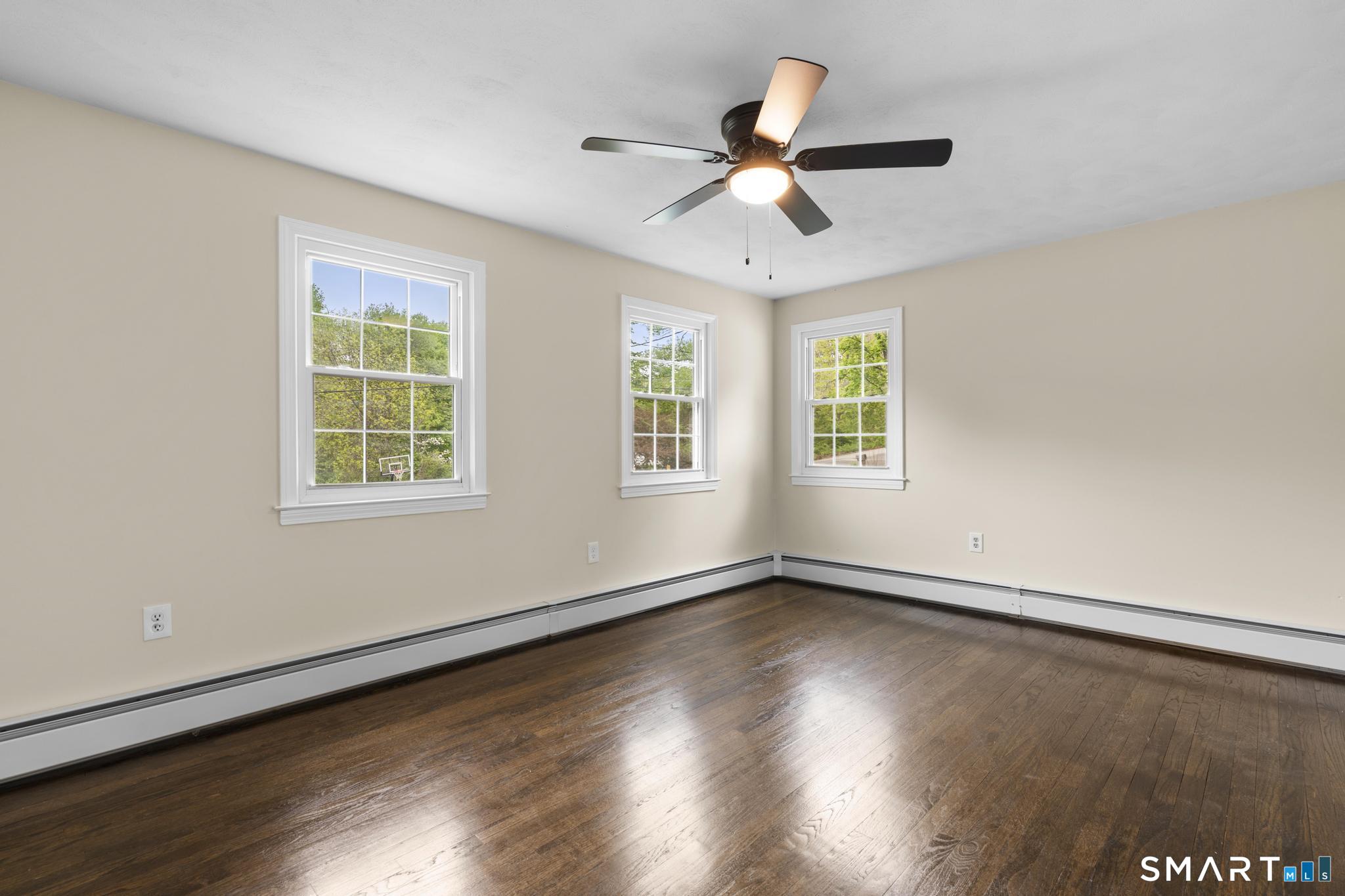 7 Sycamore Terrace Windham, CT 06280 - Photo 19 of 40 a view of an empty room with wooden floor and a window