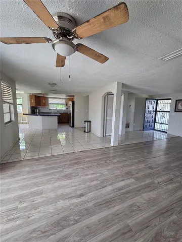 a view of a living room and a kitchen