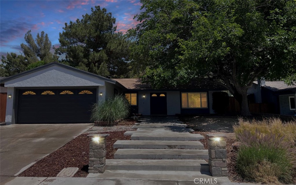 29432 Abelia Road Canyon Country, CA 91387 - Photo 1 of 1 a front view of a house with a yard