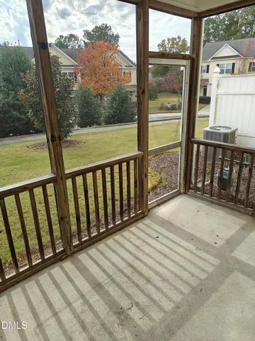 a view of a balcony with wooden floor