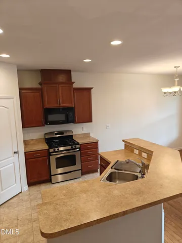 a kitchen that has a sink and a stove