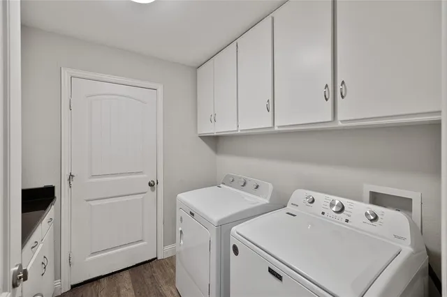 a view of storage and utility room with washer and dryer