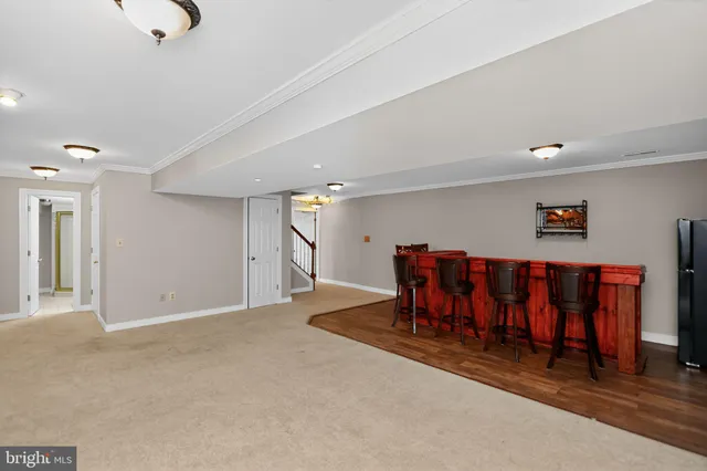 a view of an chairs and table in a room