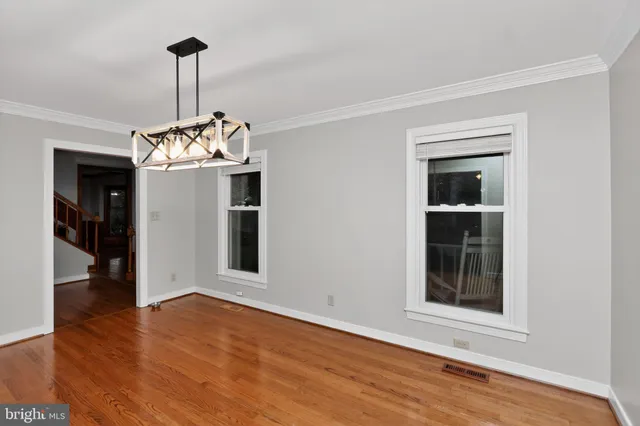 a front view of a house with a ceiling window and wooden floor