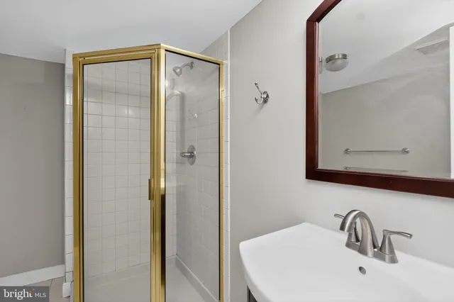 a bathroom with a sink and mirror