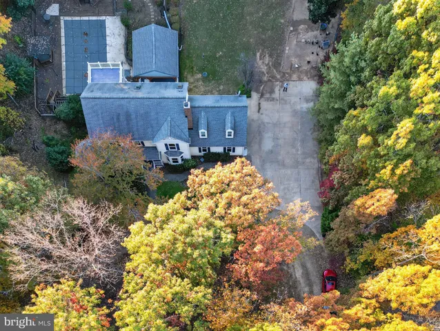 a aerial view of a house with a yard and garden