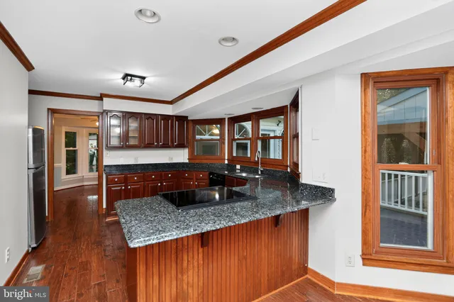a kitchen with a counter space cabinets and appliances
