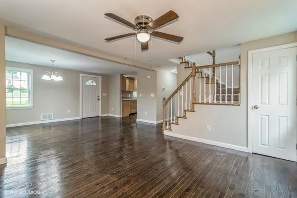 a view of an entryway with wooden floor