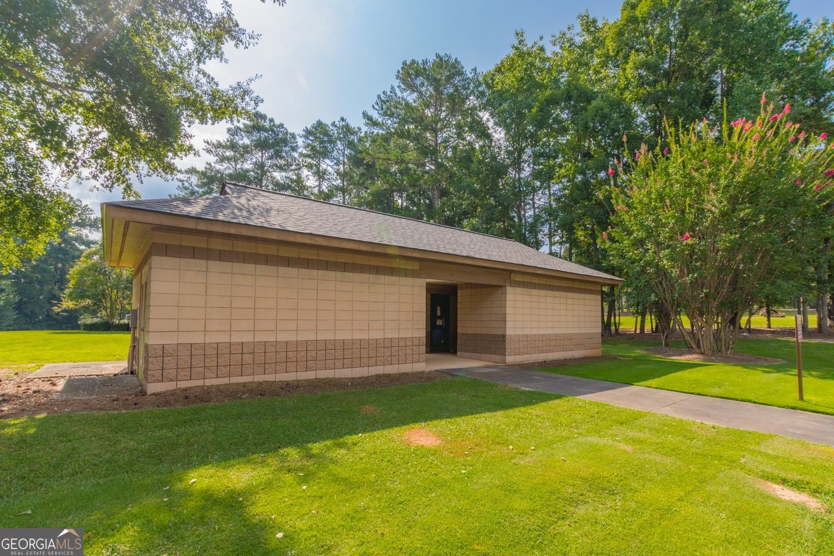 200 Willow Road, Unit 2C Peachtree City, GA 30269 - Photo 14 of 14 a view of a backyard with a small cabin