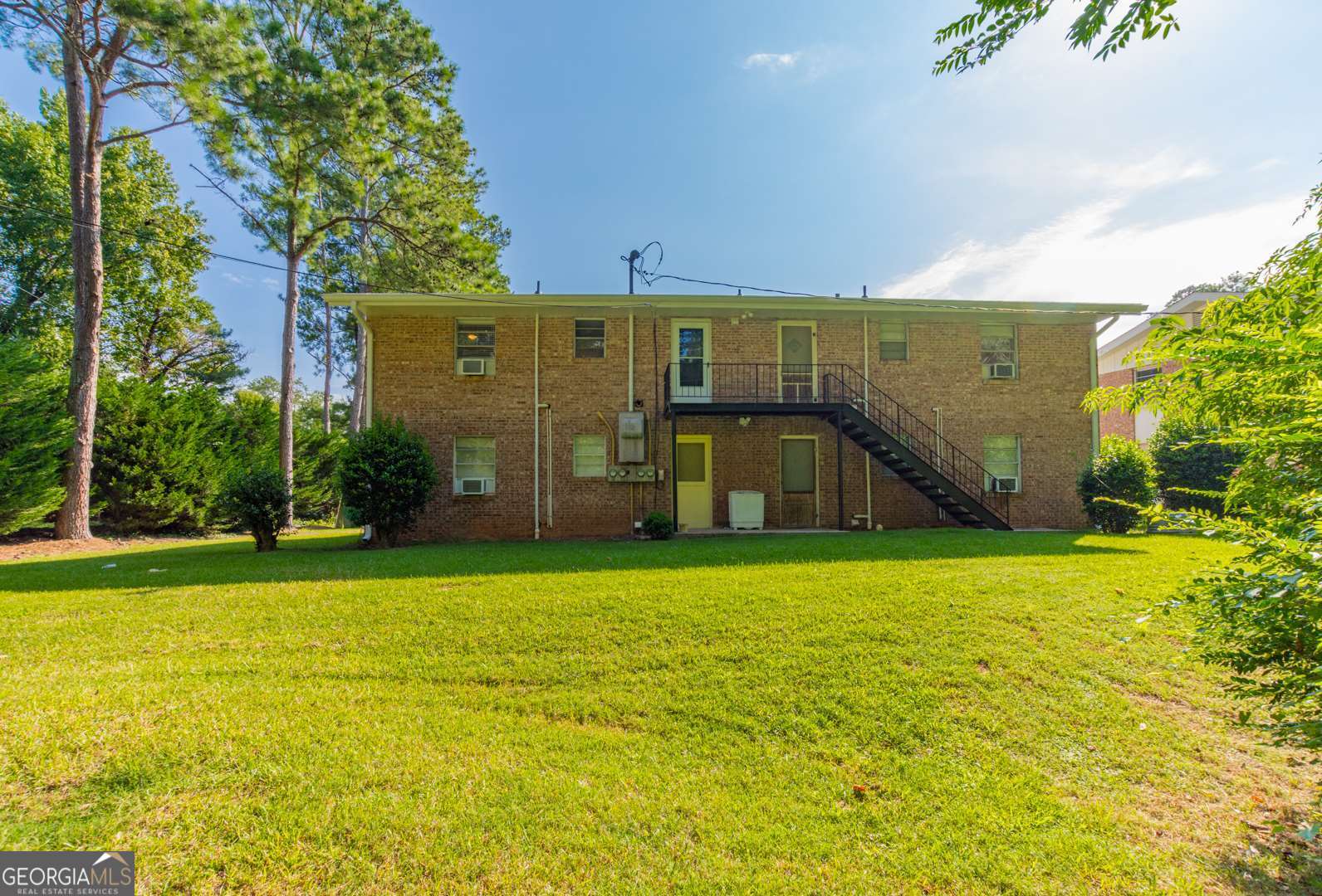 200 Willow Road, Unit 2C Peachtree City, GA 30269 - Photo 2 of 14 a view of a large building with a big yard