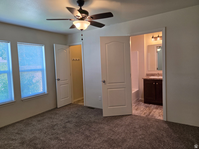 1275 Thrush Road Salt Lake City, UT 84123 - Photo 9 of 20 Bedroom featuring carpeting, dual windows, a ceiling fan, and direct access to a full bathroom