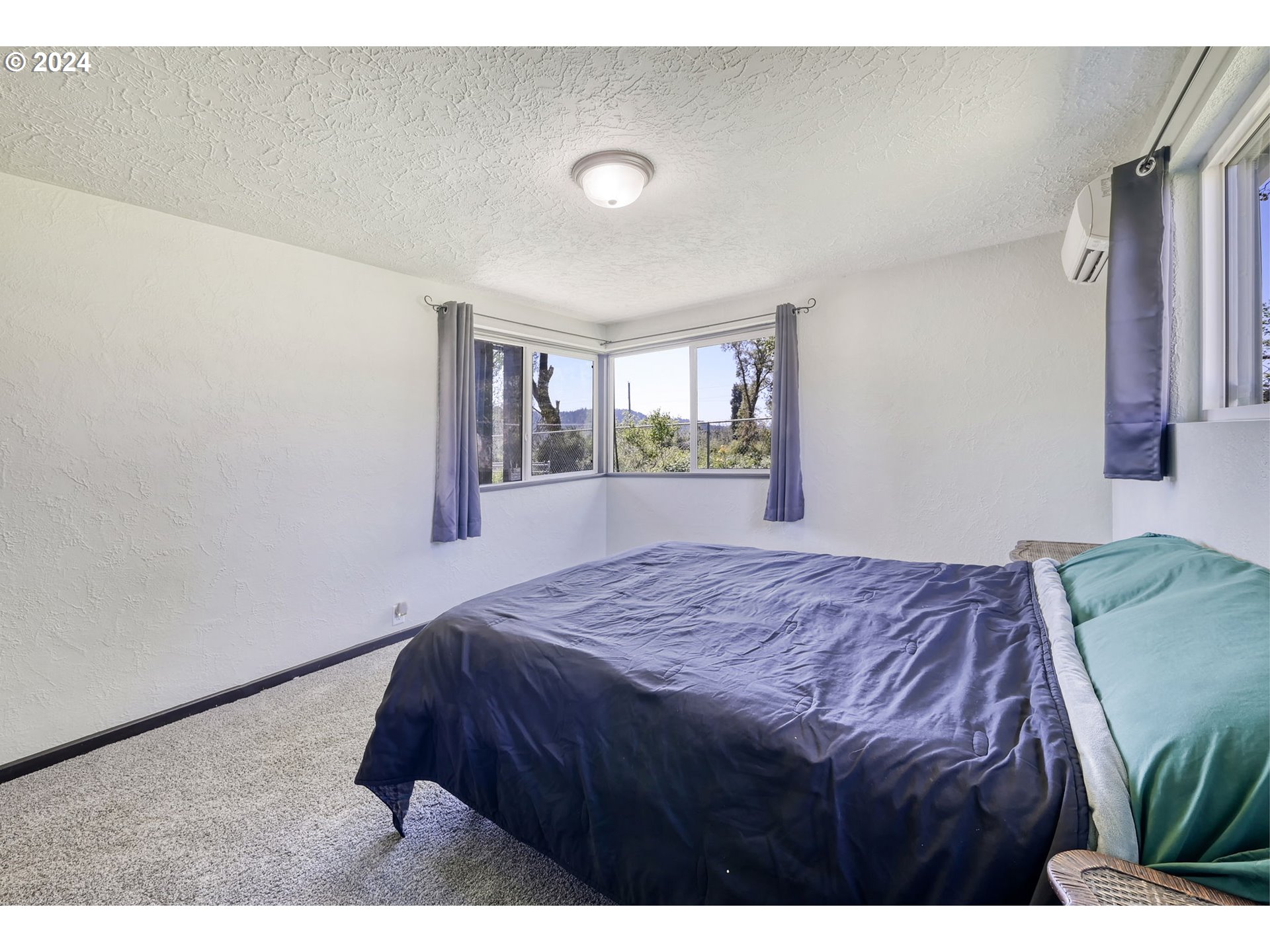 5422 Mt Vernon Road Springfield, OR 97478 - Photo 25 of 44 a bedroom with a bed and window