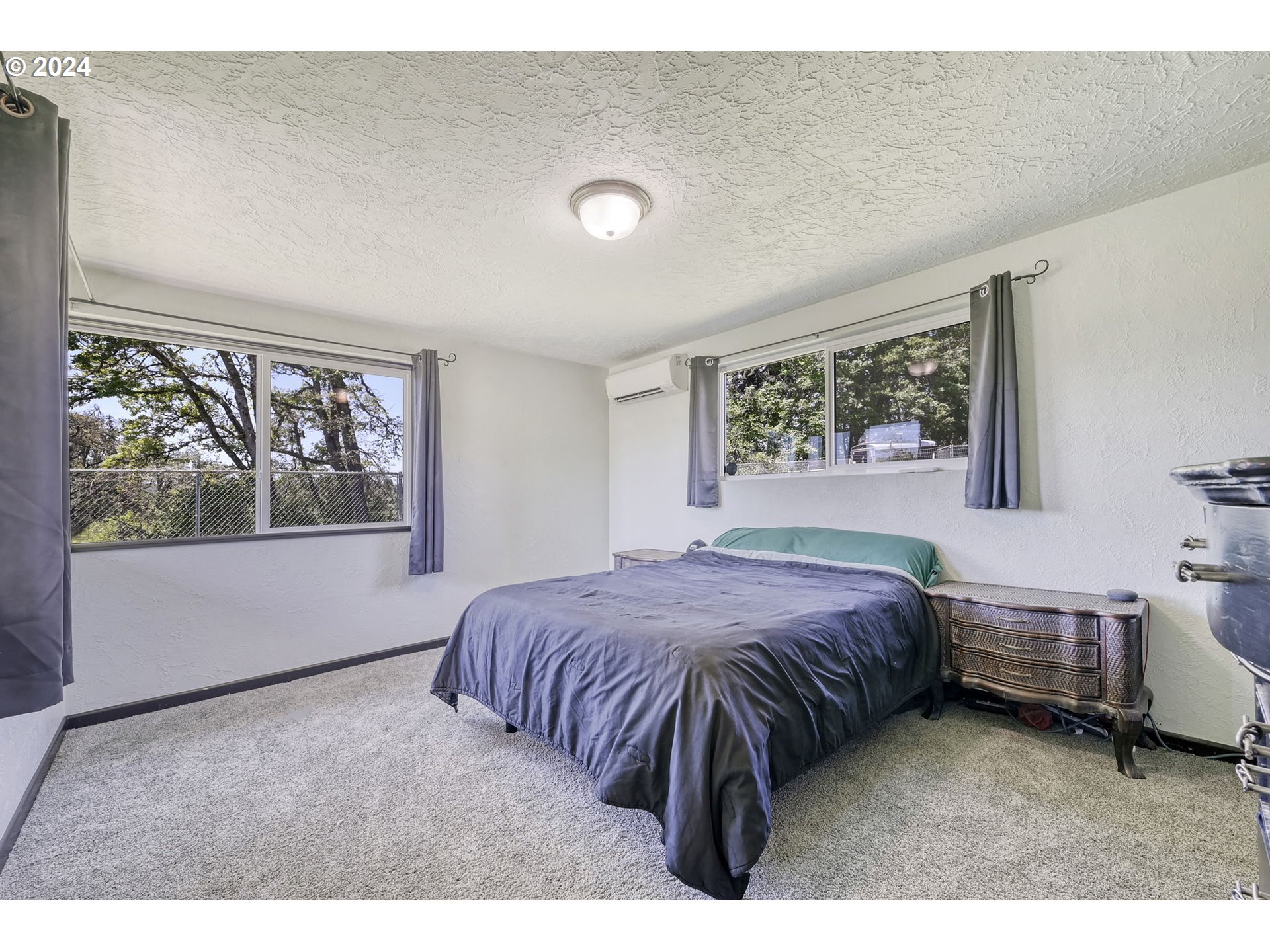 5422 Mt Vernon Road Springfield, OR 97478 - Photo 26 of 44 a bedroom with a bed table and window