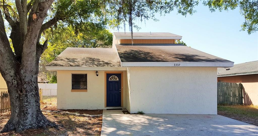 3337 Timberline Road West Winter Haven, FL 33880 - Photo 1 of 1 a view of a house with a tree