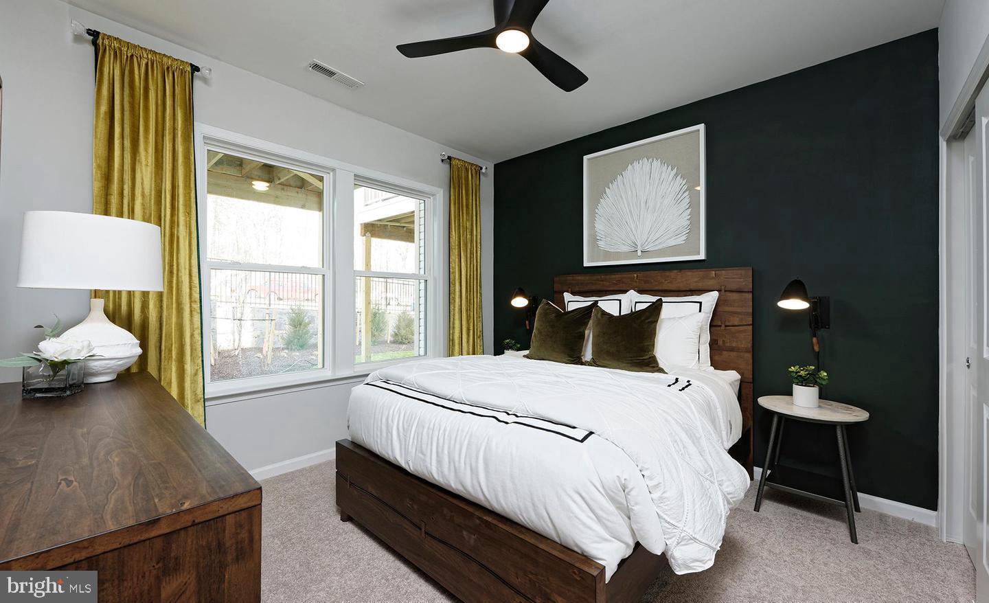 3466 Watershed Boulevard Laurel, MD 20724 - Photo 4 of 18 a bedroom with a bed and a chandelier