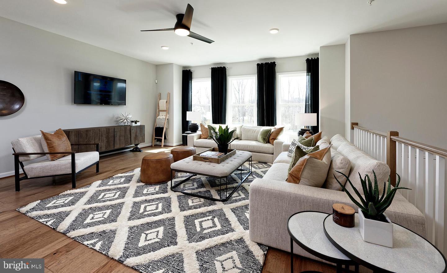 3466 Watershed Boulevard Laurel, MD 20724 - Photo 9 of 18 a living room with furniture wooden floor and a flat screen tv