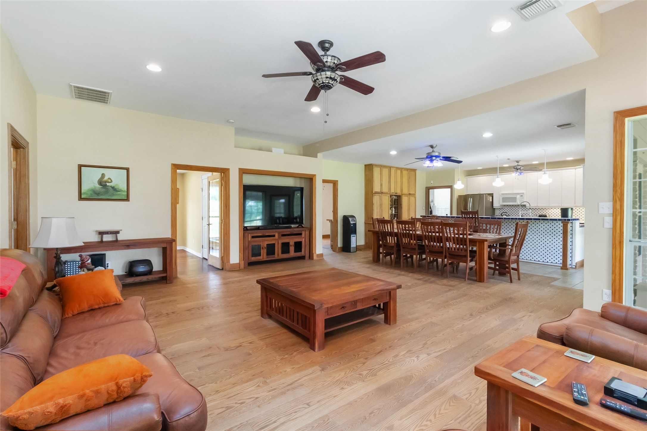 1208 Jeddo Road Rosanky, TX 78953 - Photo 6 of 40 An open concept living area seamlessly blends the kitchen, dining, and family rooms, offering effortless flow.