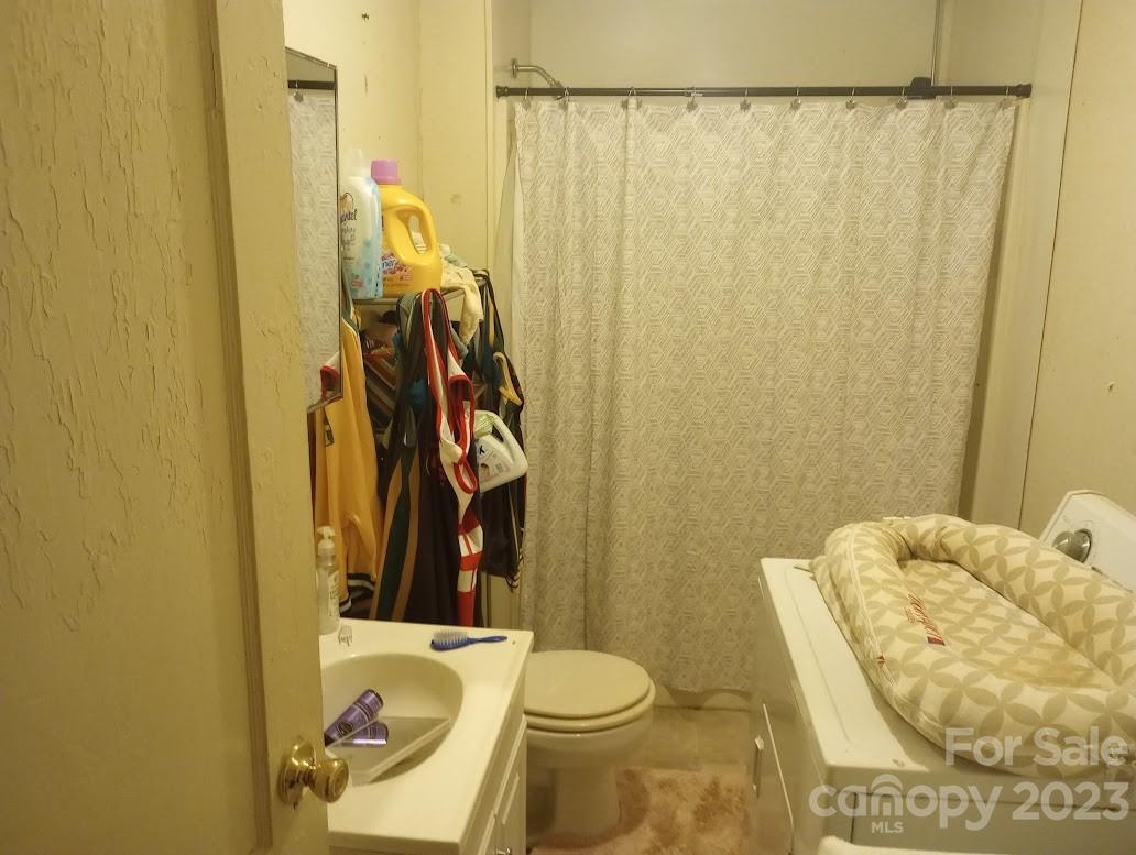 116 Flint Hill Church Road Boiling Springs, NC 28152 - Photo 12 of 18 a bathroom with a toilet and shower