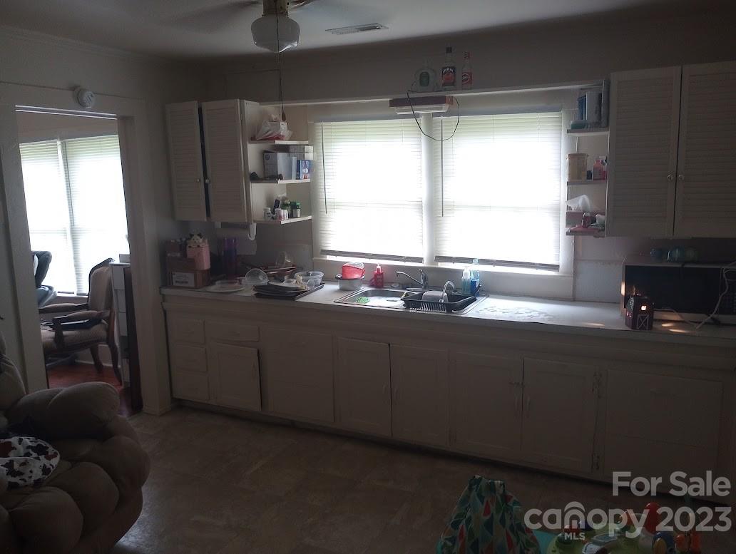 116 Flint Hill Church Road Boiling Springs, NC 28152 - Photo 14 of 18 a kitchen with granite countertop a sink and a refrigerator