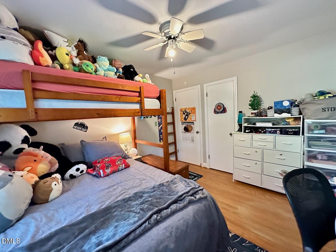 2813 Barmettler Street Raleigh, NC 27607 - Photo 17 of 22 a bedroom with bed and a window