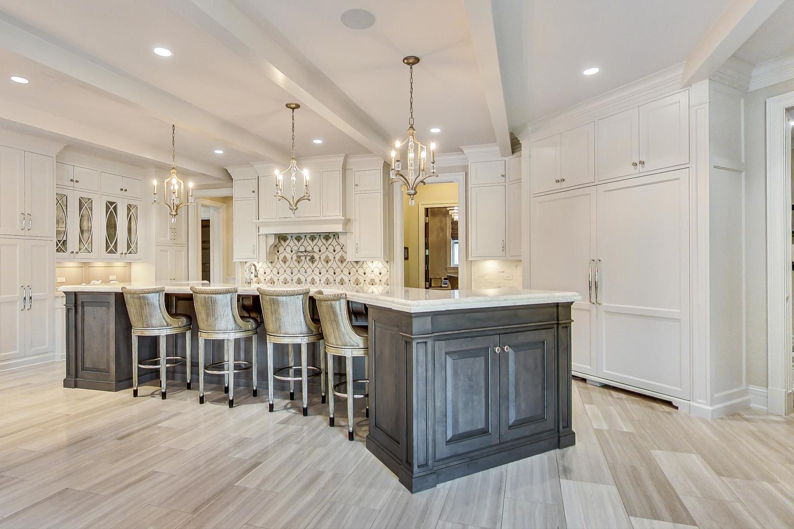 6679 Lee Court Burr Ridge, IL 60527 - Photo 13 of 98 a large kitchen with lots of counter space and stainless steel appliances