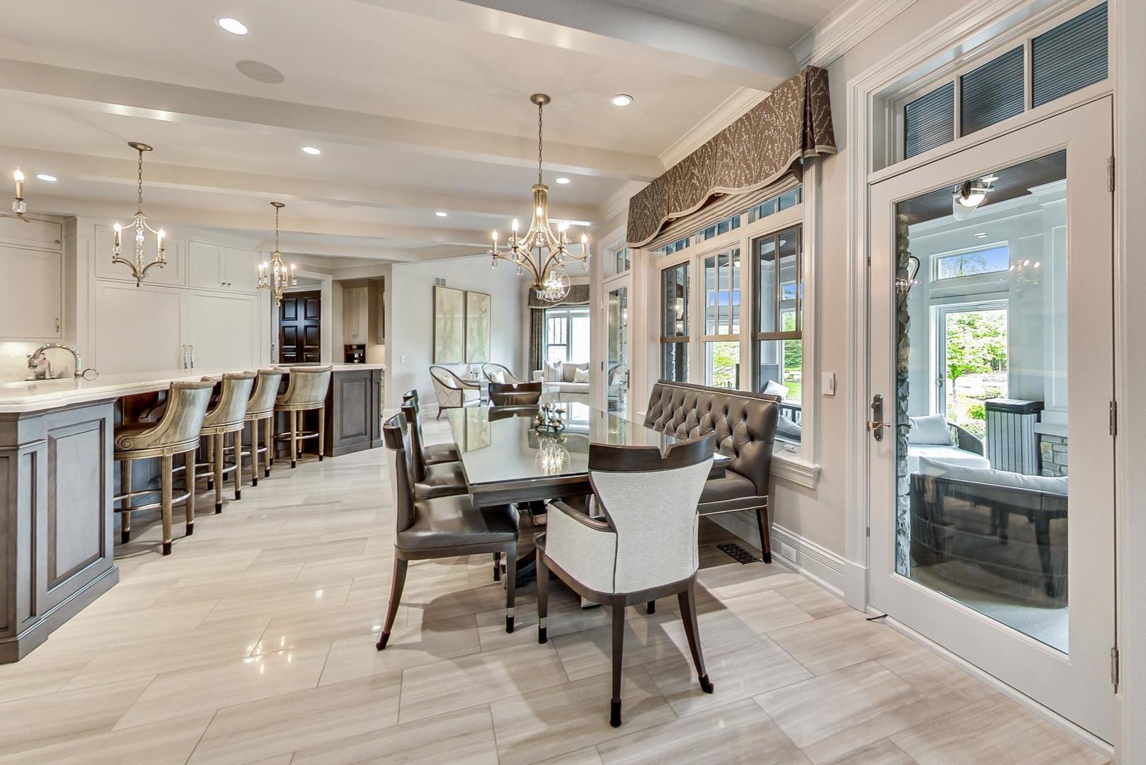 6679 Lee Court Burr Ridge, IL 60527 - Photo 17 of 98 a dining room with wooden floor a glass table and chairs