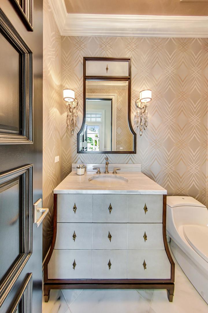 6679 Lee Court Burr Ridge, IL 60527 - Photo 28 of 98 a bathroom with a sink mirror and bathtub