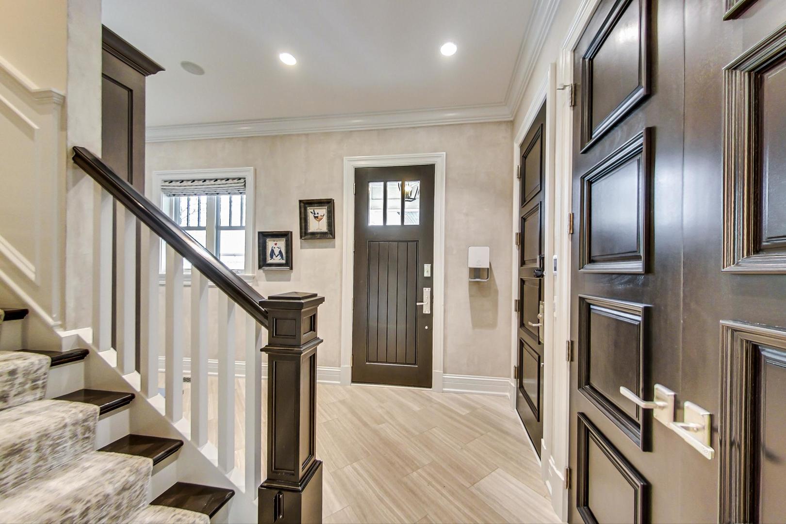 6679 Lee Court Burr Ridge, IL 60527 - Photo 31 of 98 a view of a hallway with wooden floor and staircase