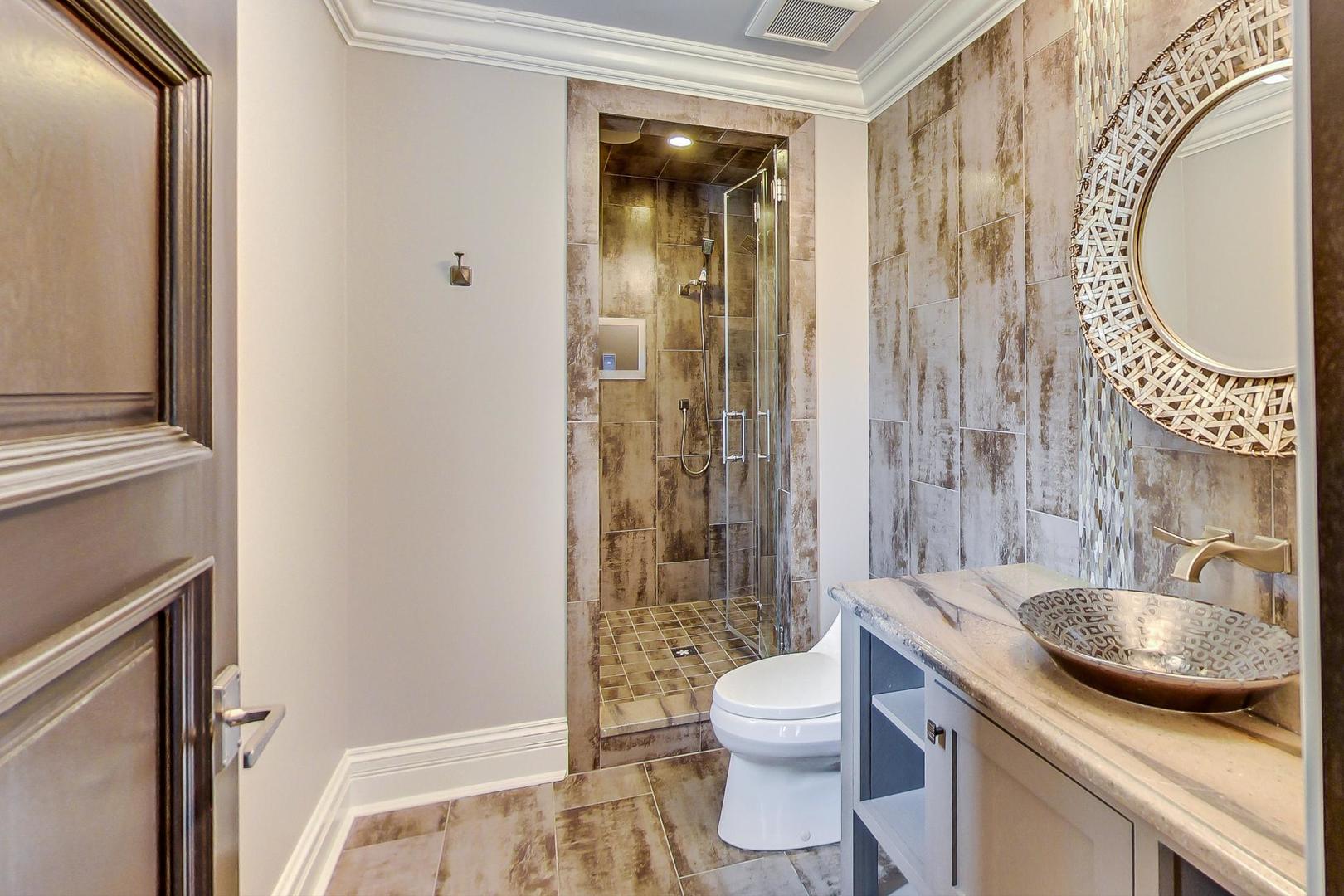 6679 Lee Court Burr Ridge, IL 60527 - Photo 56 of 98 a bathroom with a sink a toilet and a mirror