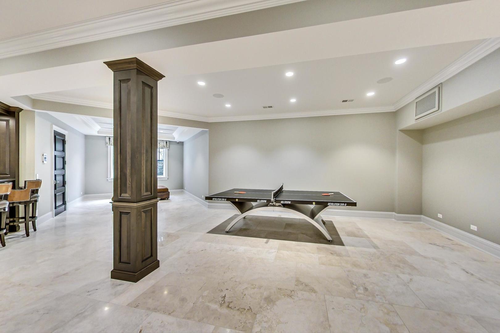 6679 Lee Court Burr Ridge, IL 60527 - Photo 64 of 98 a room with gym equipment and large mirror
