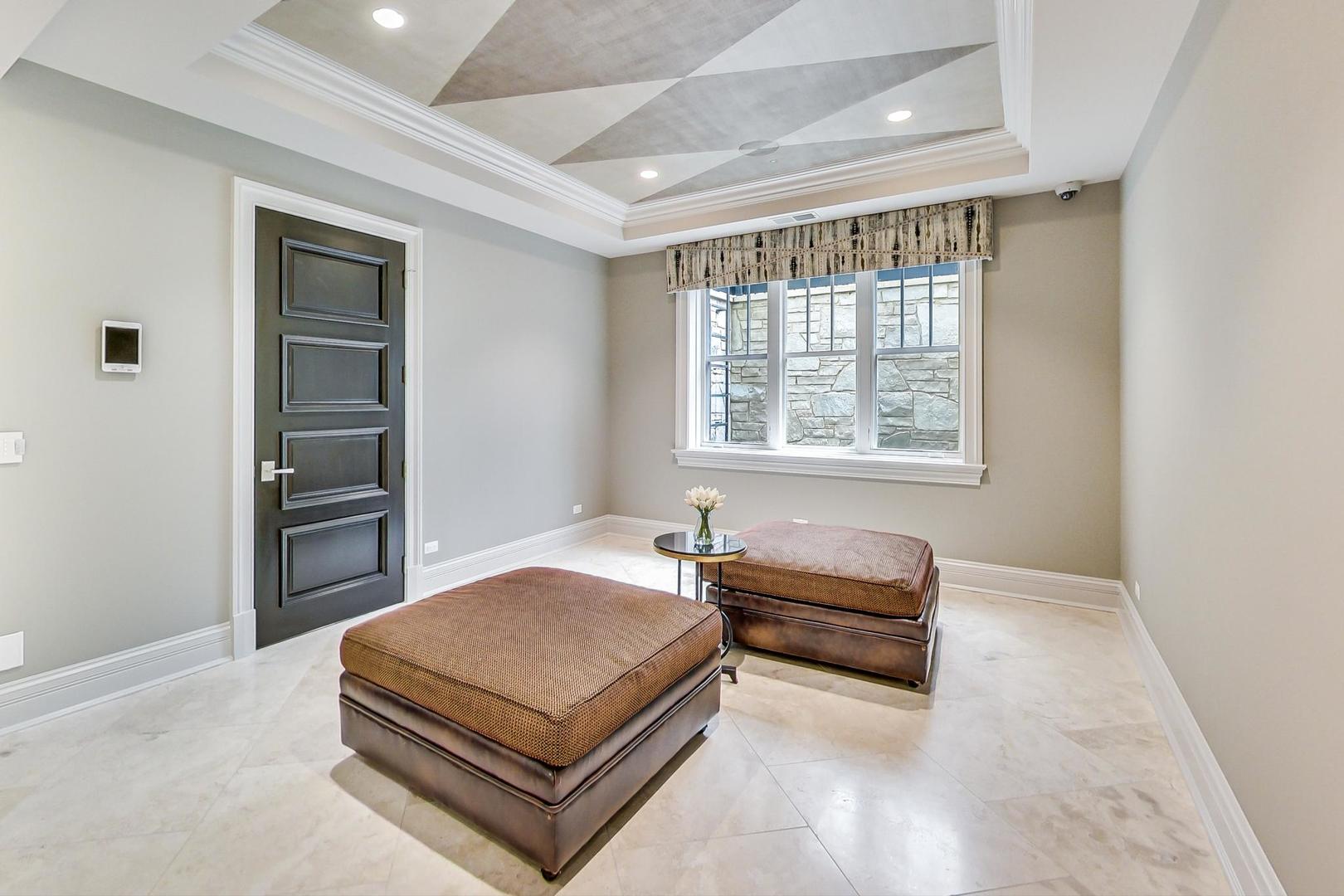 6679 Lee Court Burr Ridge, IL 60527 - Photo 66 of 98 a bedroom with a bed and a window