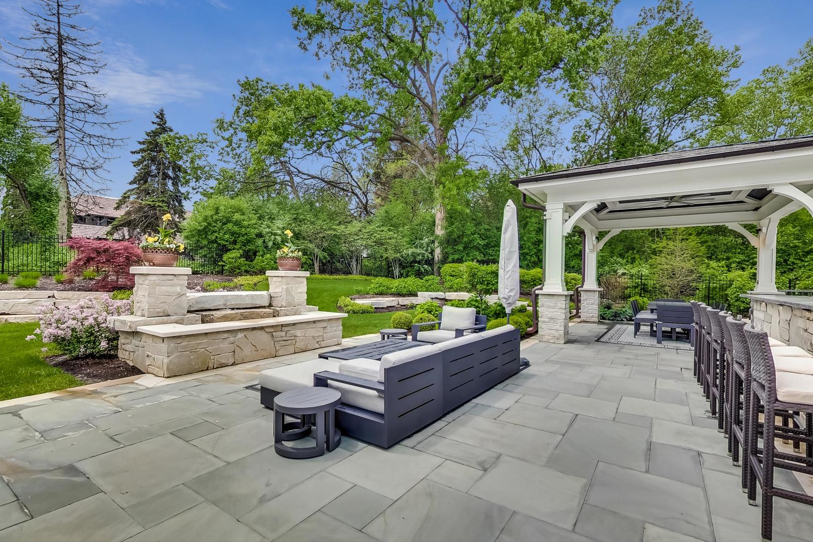 6679 Lee Court Burr Ridge, IL 60527 - Photo 87 of 98 a view of a backyard with sitting area and garden
