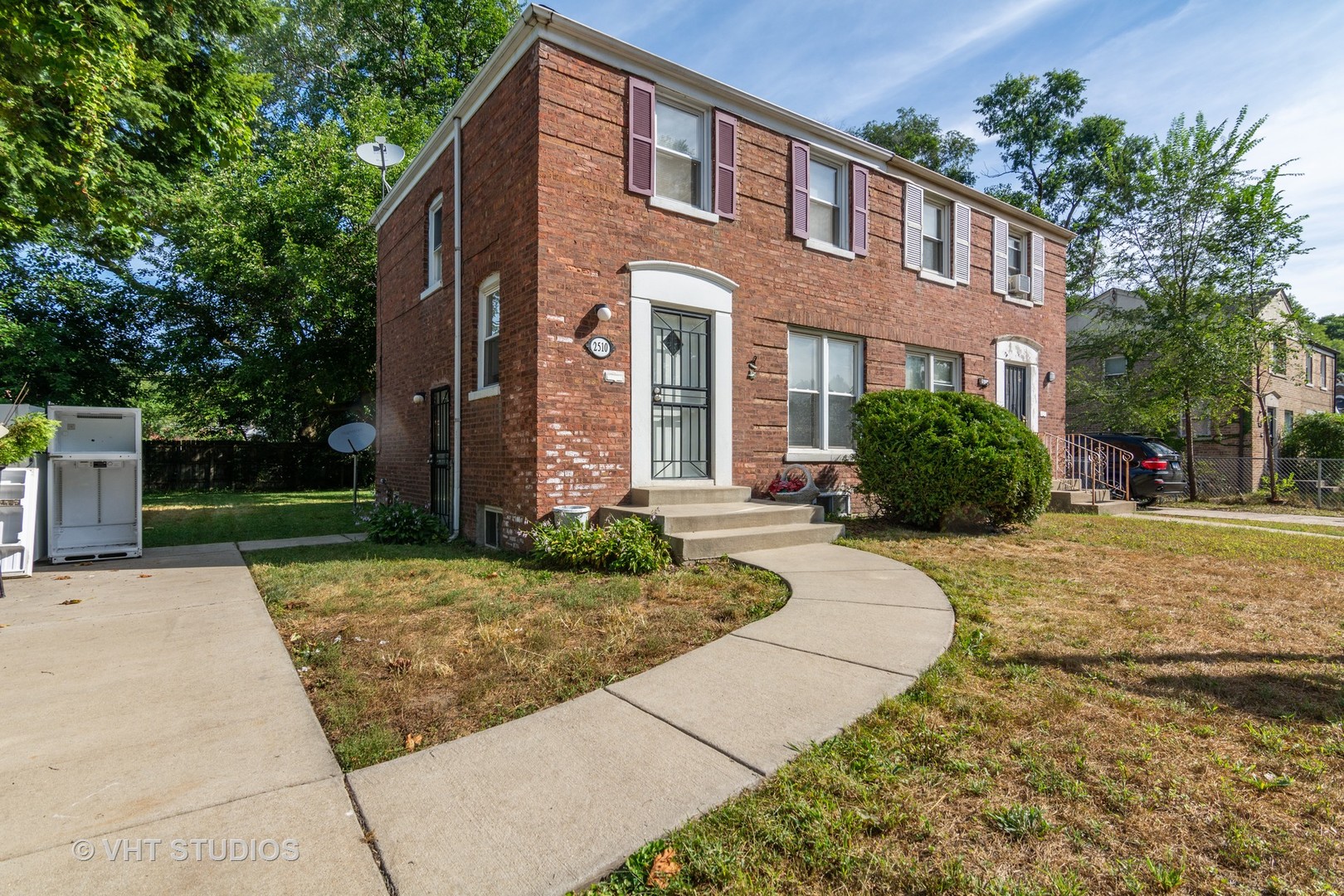 2510 East 96th Street Chicago, IL 60617 - Photo 2 of 13 a front view of a house with garden