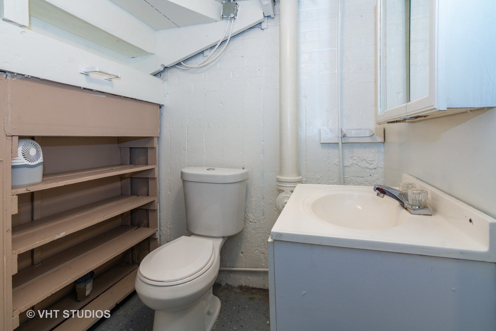 2510 East 96th Street Chicago, IL 60617 - Photo 12 of 13 a bathroom with a sink and a toilet