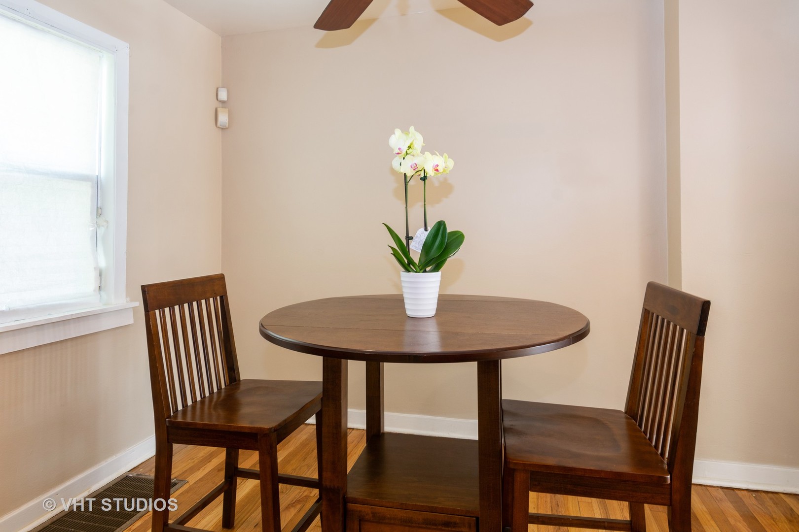 2510 East 96th Street Chicago, IL 60617 - Photo 7 of 13 a view of a dining room with furniture and wooden floor